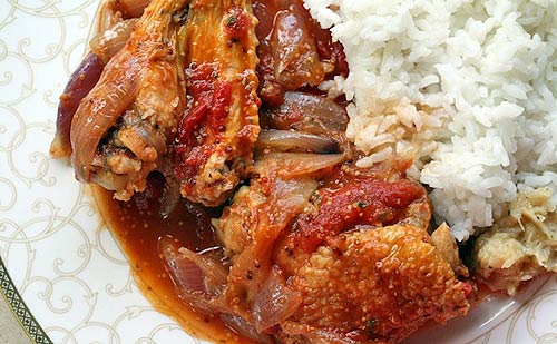 Chicken stew with onions, tomatoes, and Dijon
