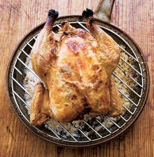 Chicken stuffed with garlic croutons roasted over a bed of salt