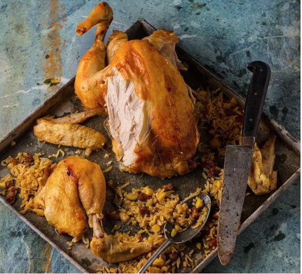 Chicken stuffed with rice, almonds, and raisins