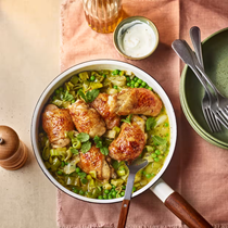 Chicken thighs braised with leeks, peas, mint and sour cream