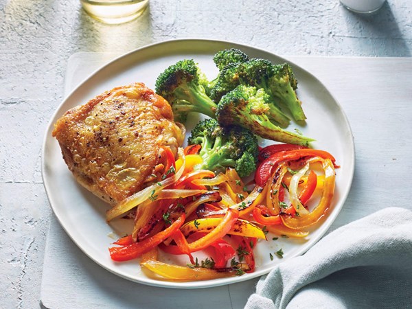 Chicken thighs with pepperonata and roasted broccoli