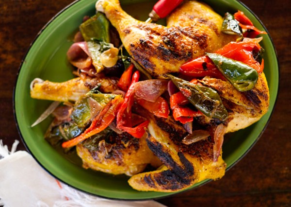 Chicken under a brick with avocados and chiles
