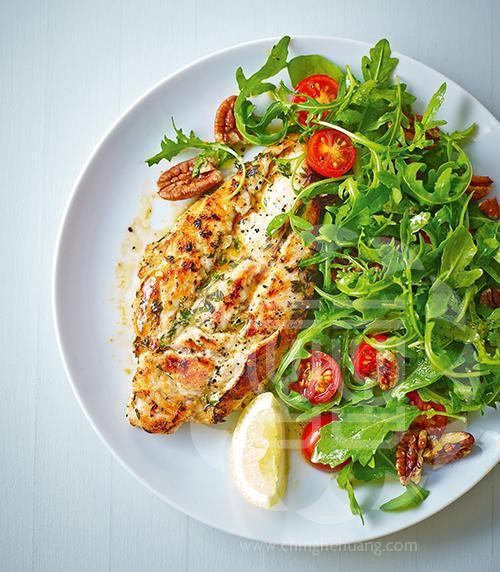Chicken with garlic, lemon, herbs and rocket, cherry tomatoes and pecan salad