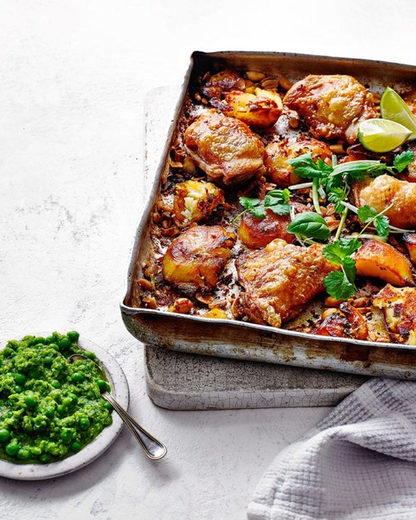 Chicken with peanut roasties and lime, pepper & pea sauce