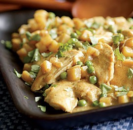 Chicken with potatoes, peas & coconut-curry sauce