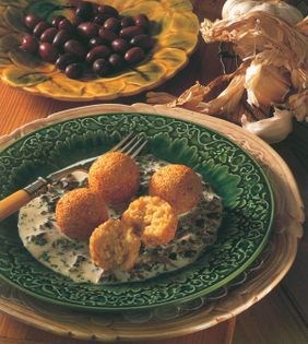 Chickpea and sesame fritters with garlic and olive sauce