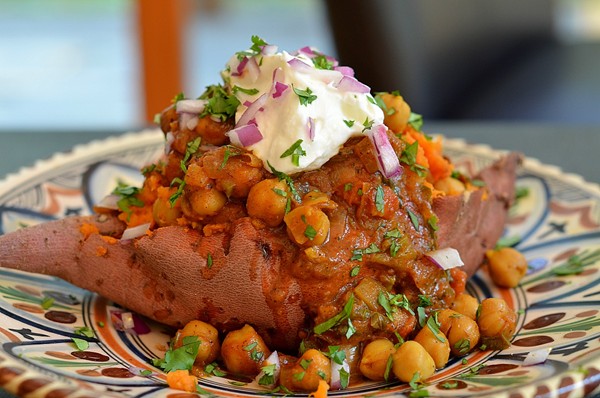 Chickpea curry-topped sweet potatoes