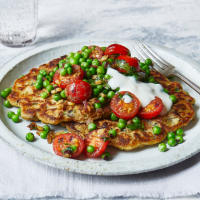 Chickpea pancakes with peas and tomatoes