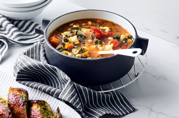 Chickpea ribollita with baby ravioli and pesto garlic bread