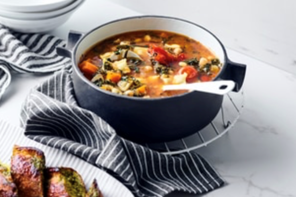 Chickpea ribollita with baby ravioli and pesto garlic bread