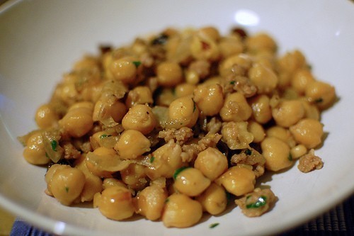 Chickpeas with sausage, raisins and pine nuts