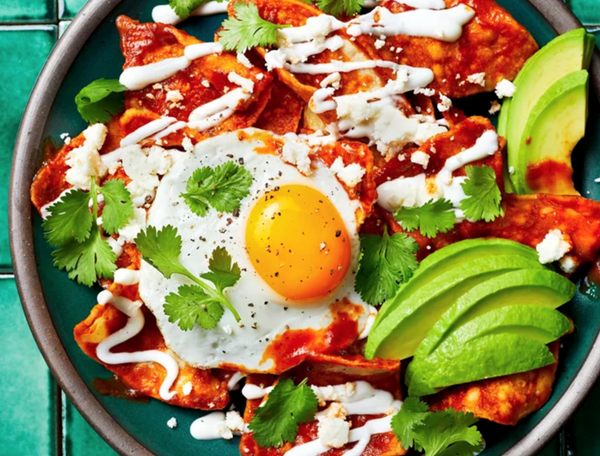 Chilaquiles rojos with fried eggs and cotija
