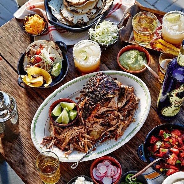 Chile-braised pork shoulder with taco fixings