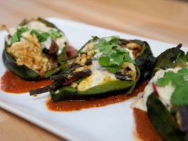 Chiles rellenos with migas, pulled chicken, and cheese sauce