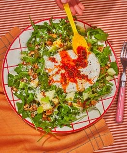 Chili crisp burrata salad with arugula, apple, and walnuts
