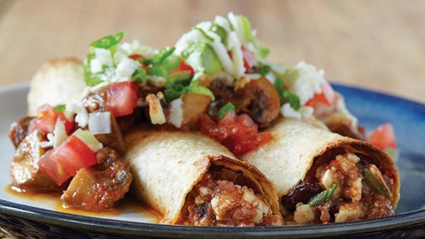 Chili-stuffed enchiladas with roasted-mushroom sauce