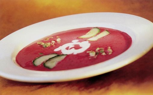 Chilled beetroot soup with soured cream, cucumber and scallions