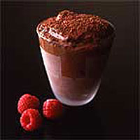 Chilled chocolate pots with orange and pistachio nuts