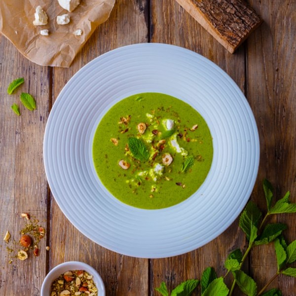 Chilled courgette soup, goat's curd, dukkah, mint