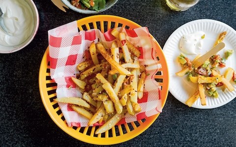 Chilli-cheese fries with avocado salsa and sour cream