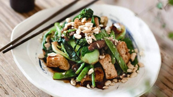 Chinese greens stir-fried with tofu, mushrooms and peanuts