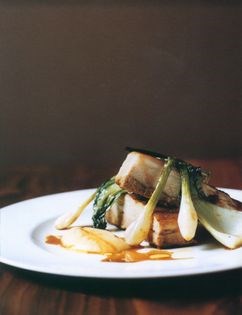 Chinese spiced roast pork with spring onions and pak choi