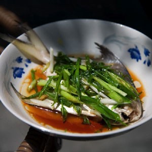 Chinese steamed fish with scallions