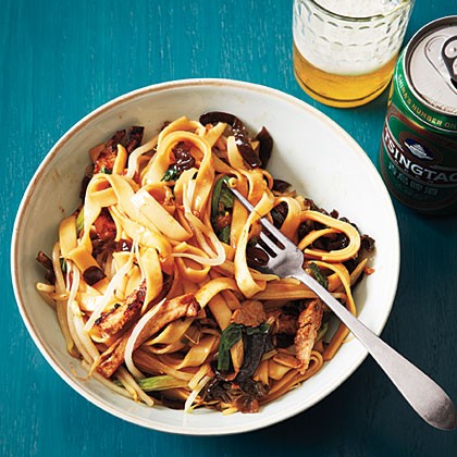 Chinese wide noodles with barbecue pork and dried mushrooms
