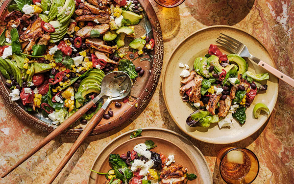 Chipotle chicken salad with black beans, roast tomatoes and sweetcorn