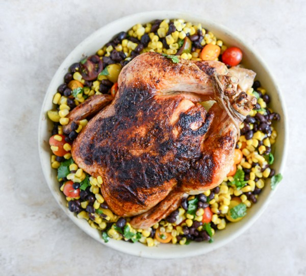 Chipotle lime butter whole roasted chicken with black bean + corn salad