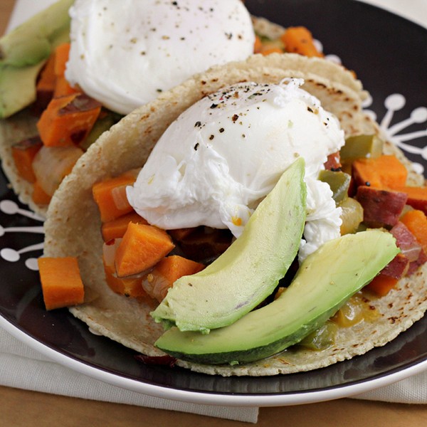 Chipotle-sweet potato hash tacos with poached eggs and avocado