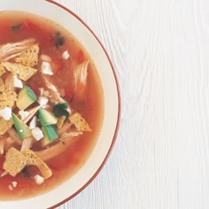 Chipotle tortilla soup with turkey and lime