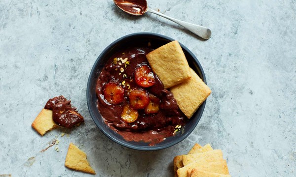 Chocolate and banana pots with orange biscuits
