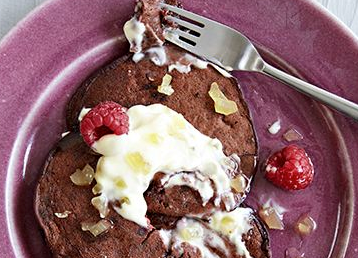 Chocolate and beetroot pancakes with ginger cream and raspberries