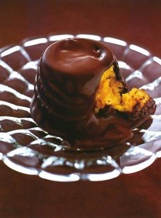 Chocolate bombe filled with white chocolate risotto