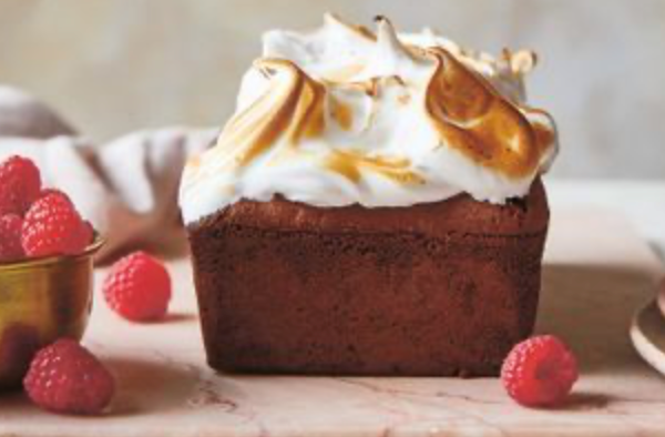 Chocolate cake topped with Swiss meringue cloud