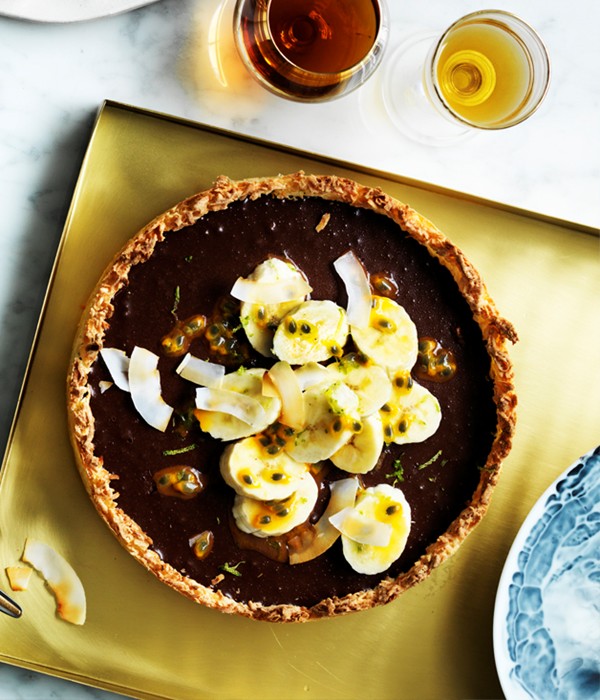 Chocolate coconut tart with passionfruit and banana