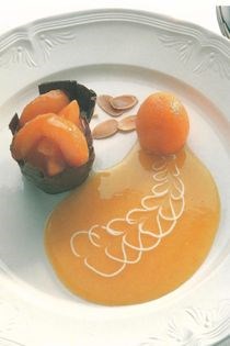Chocolate cup filled with an almond cream and poached apricots, with an apricot puree [Ian McAndrew]