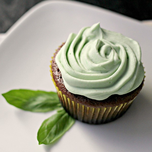 Chocolate cupcakes with basil buttercream frosting