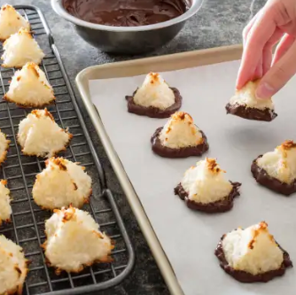 Chocolate-dipped triple-coconut macaroons