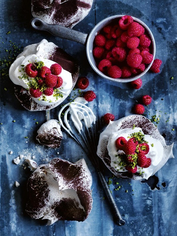 Chocolate-dusted Pavlovas with raspberries and pistachios