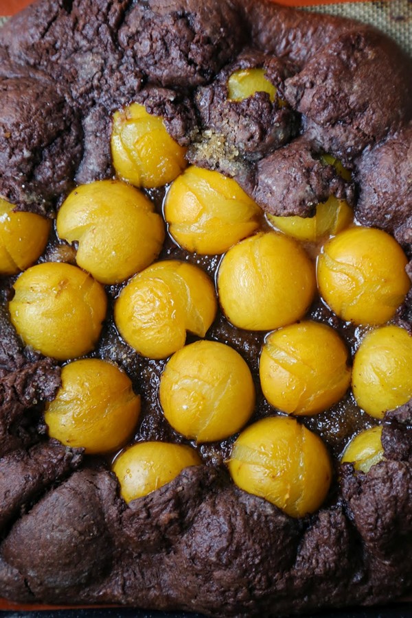 Chocolate galette with yellow plums