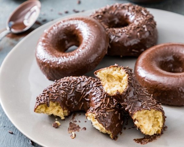 Chocolate-glazed baked cake doughnuts
