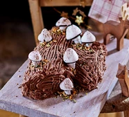 Chocolate hazelnut yule log with meringue mushrooms