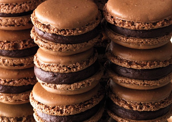 Chocolate macaroons with orange ganache