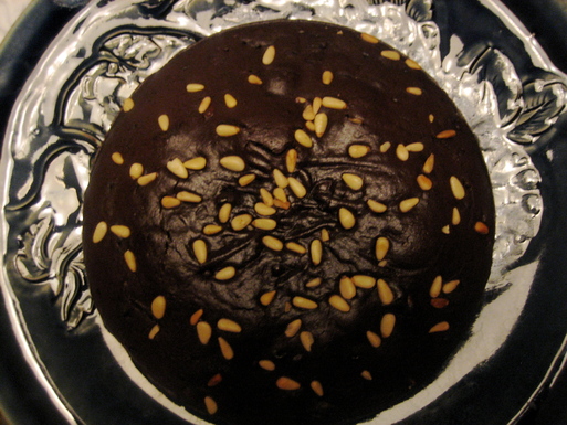Chocolate olive oil cake with pine nuts