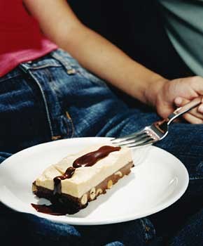 Chocolate peanut butter bars with hot fudge sauce