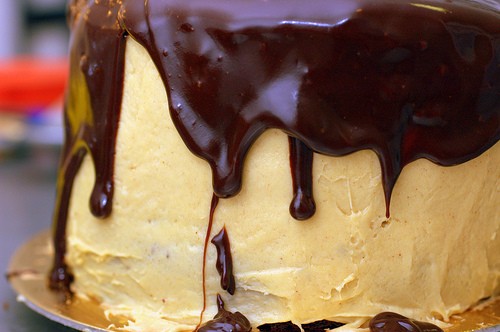 Chocolate peanut butter cake with peanut butter frosting and chocolate-peanut butter glaze
