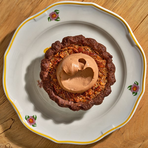 Chocolate pecan pie with Chantilly cream 