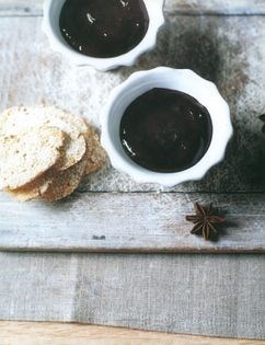 Chocolate pots with star anise and biscotti